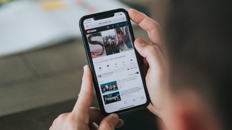 Person using YouTube website on a mobile device