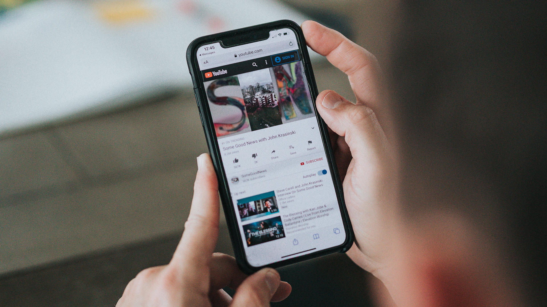 Person using YouTube website on a mobile device