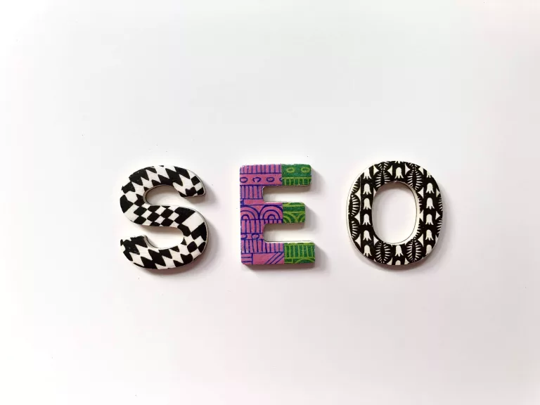 S, E and O patterned letters on an off-white background